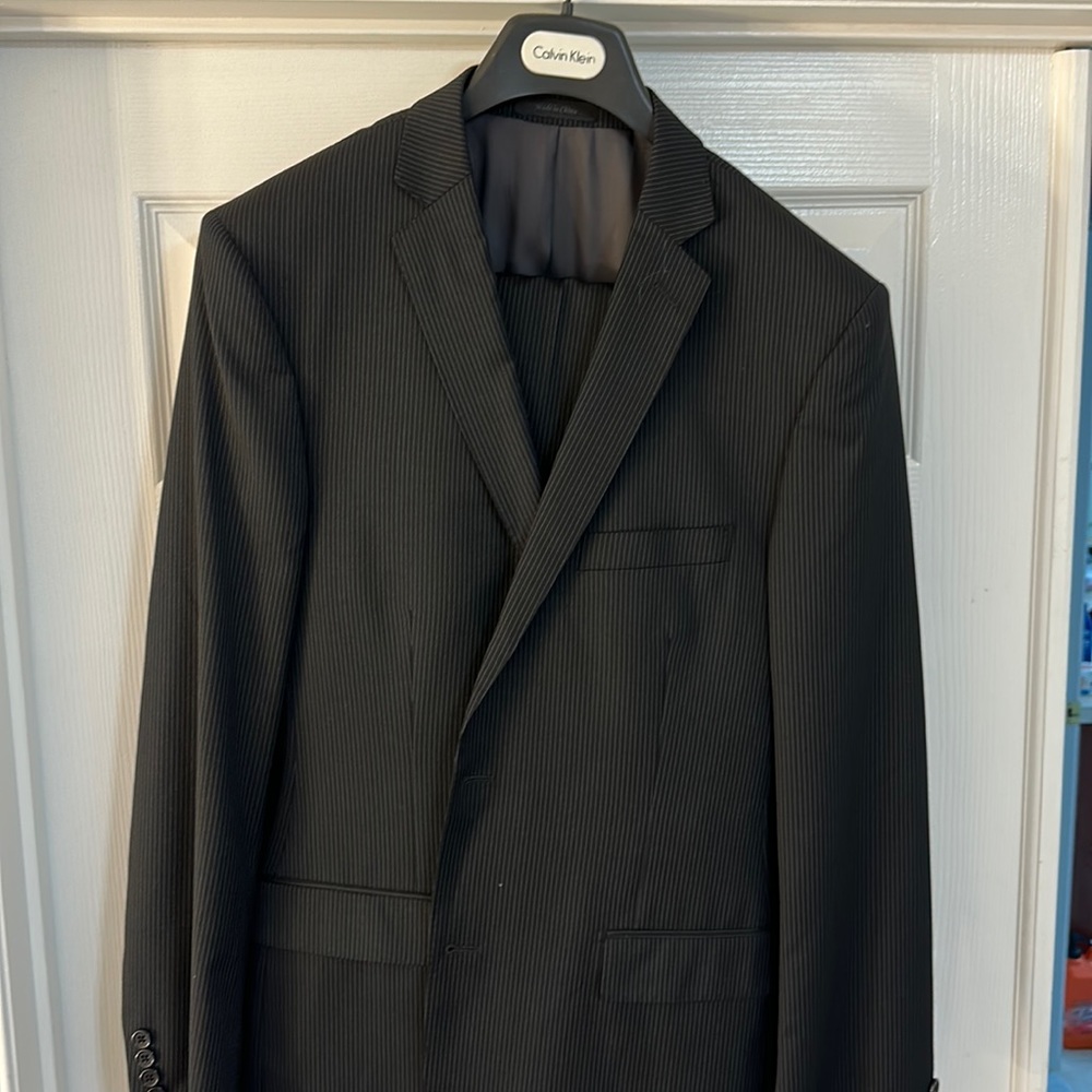 Calvin Klein two-piece pinstripe suit.  44L jacket, 37W pants unhemmed.